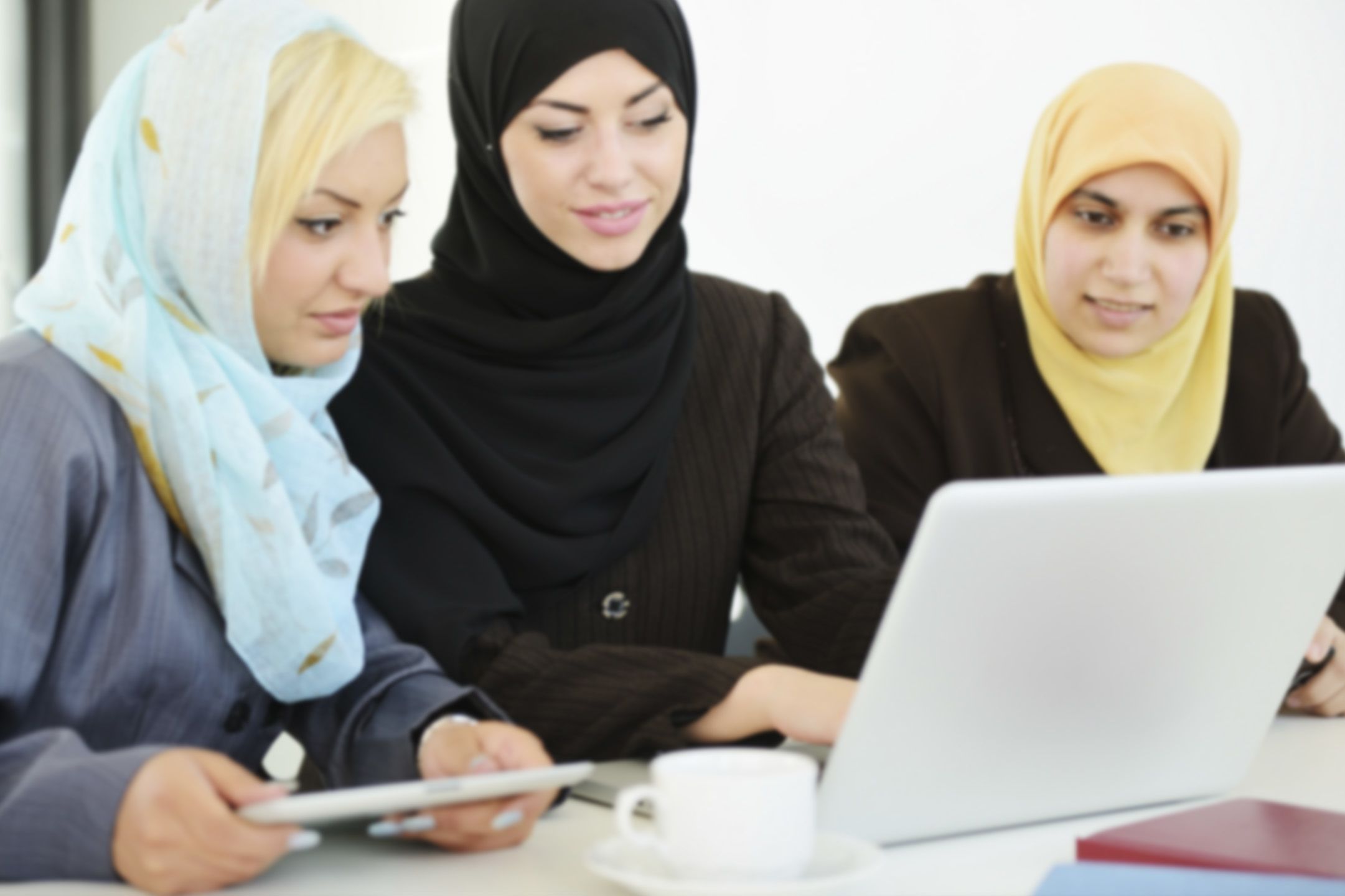 Image: Women sharing a laptop