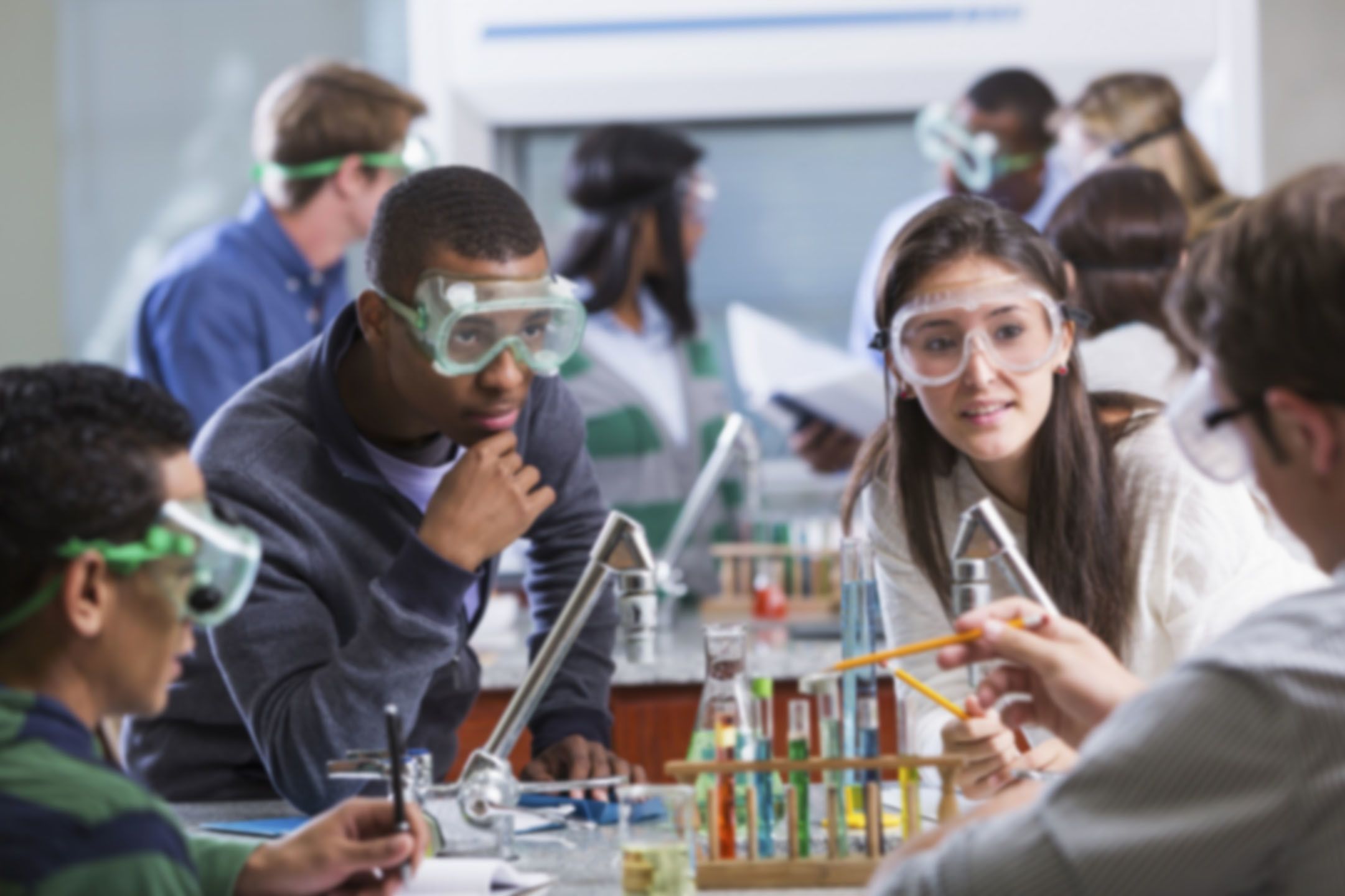 Image: boy thinking in chemistry class